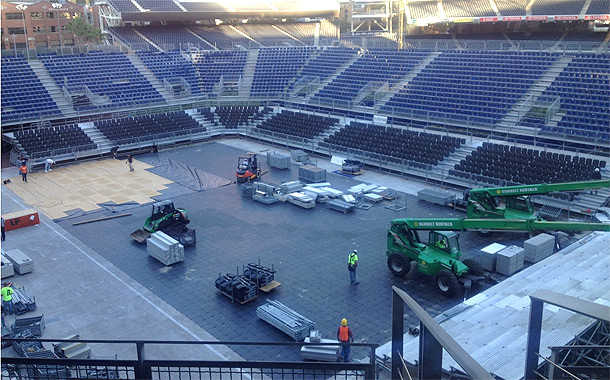 Several layers of protection went down first to ensure that the grass won't be completely mangled. (Courtesy of the USTA)